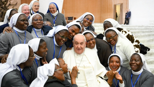 Pope Francis gathers with a group of religious sisters for a group photo at the end of his weekly general audience in the Paul VI Audience Hall at the Vatican Feb. 28, 2024. (CNS photo/Vatican Media)